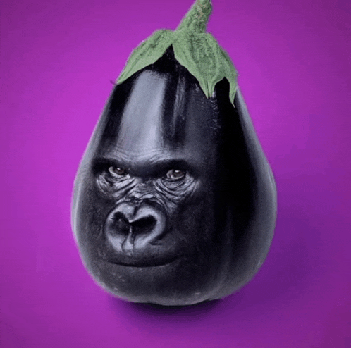 a black eggplant with a gorilla face on it