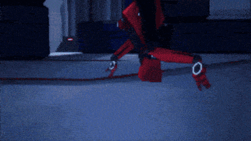 a red robot with the number 3 on it 's chest