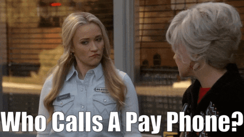 a woman talking to another woman and the words who calls a pay phone