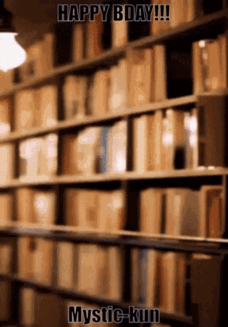 a blurred image of a bookshelf with the words happy bday mystic kun