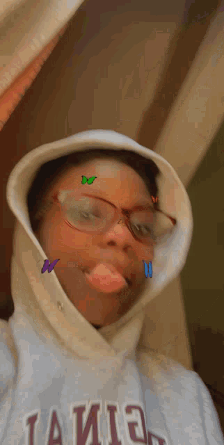 a girl wearing glasses and a hoodie that says ' a ' on it