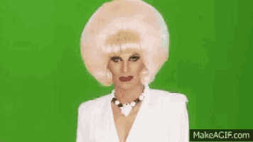 a woman in a wig with the words my grandson 's studying magic behind her