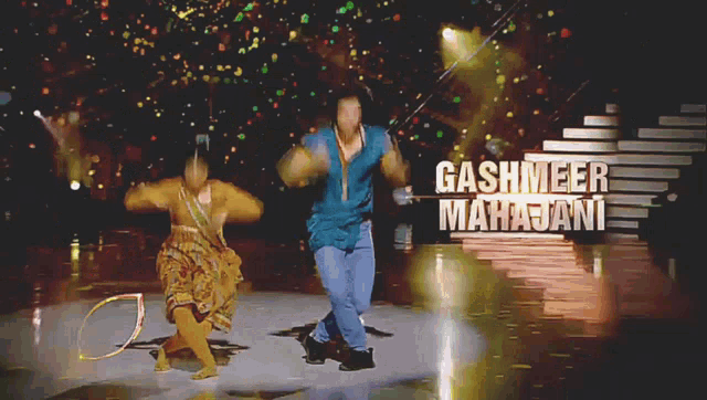 a man and a woman are dancing on a stage with the name gashmeer mahajani