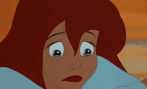 a close up of a cartoon character 's face with tears running down her face