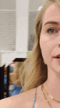 a close up of a woman 's face with a blurred background
