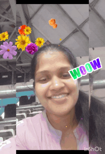 a woman is smiling with flowers and the word woow on her face