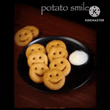 a plate of potato smiles with sour cream on a wooden table .