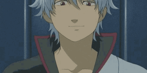 a close up of a cartoon character with gray hair making a face .