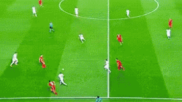 soccer players on a field with repsol advertisements