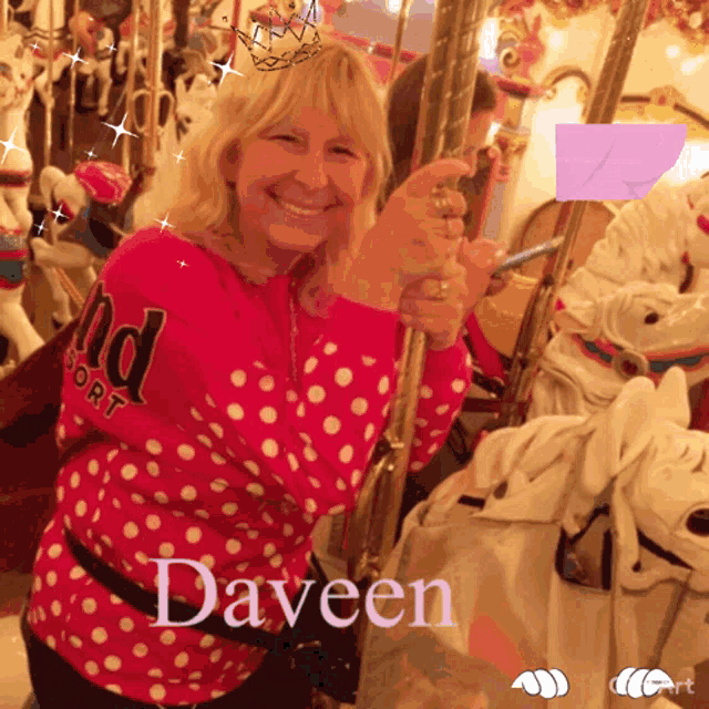 a woman in a pink polka dot shirt is riding a merry go round with the name daveen below her