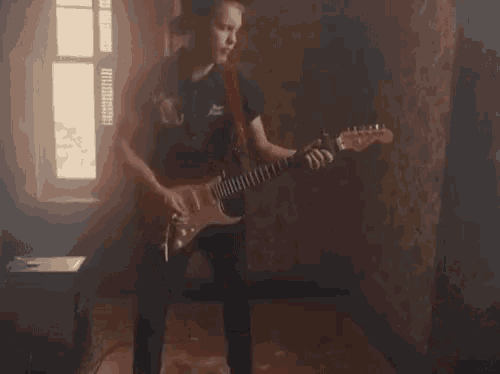 Strumming Guitarist GIF - Strumming Guitarist Electric Guitar GIFs