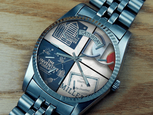 a silver wristwatch with the inventive podcasts written on the face