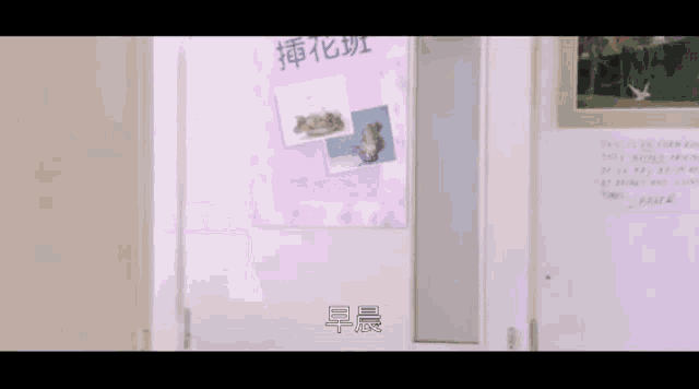 a person is standing in front of a sign that says ' chinese ' on it .