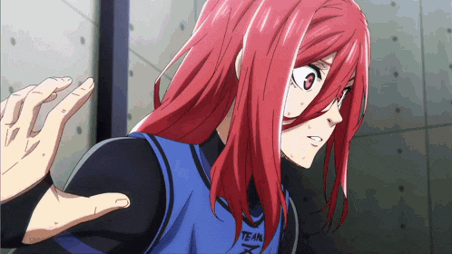 a girl with red hair is wearing a blue shirt that says team on it