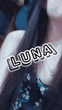 a close up of a woman 's face with the word luna written on it