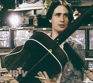a man is holding a guitar that says jbv on it