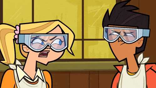 a boy and a girl are wearing goggles and making funny faces