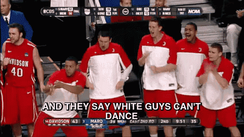 a group of basketball players are dancing in front of a screen that says and they say white guys can t dance