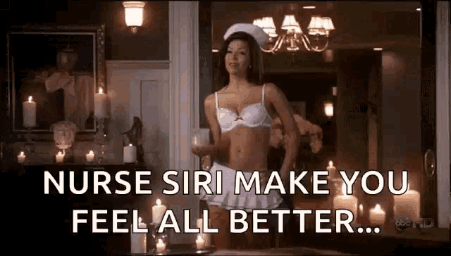 a woman in a bra and skirt is dancing in a room with candles .