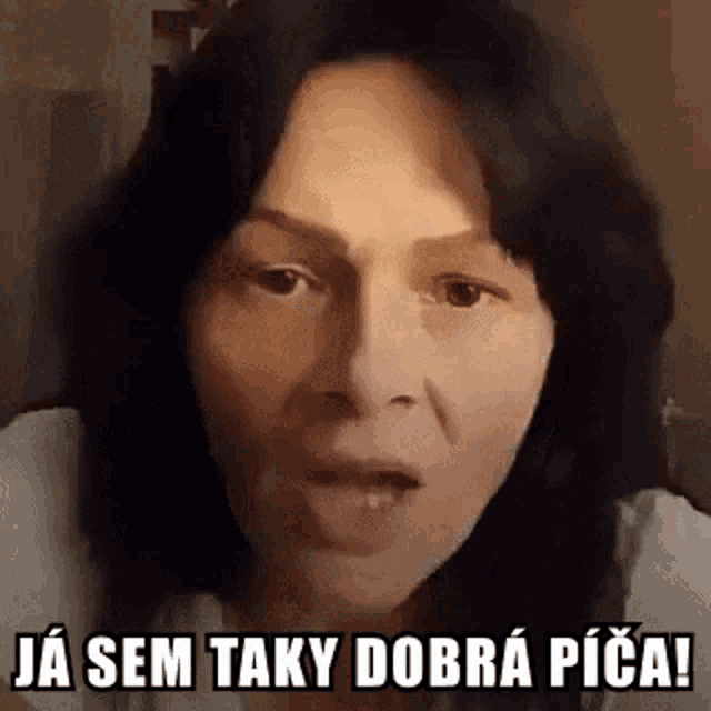 a woman is making a funny face with the words `` ja sem taky dobra pica '' above her .