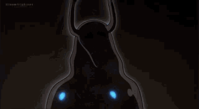 a cartoon of a demon with horns and blue eyes .
