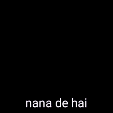 a woman in a striped shirt is taking a selfie with the words nana de hai written on her shirt .