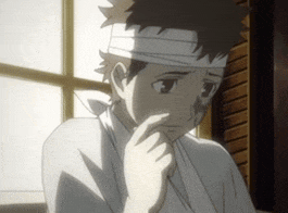 a boy with a bandage on his head is looking down