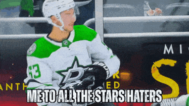 a hockey player in a green and white jersey with the number 43 on it