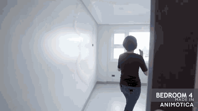 a woman is standing in a room with the words bedroom 4 made in animonica on the bottom