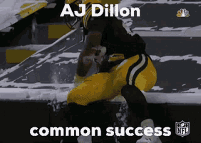aj dillon is a green bay packers player and is kneeling down