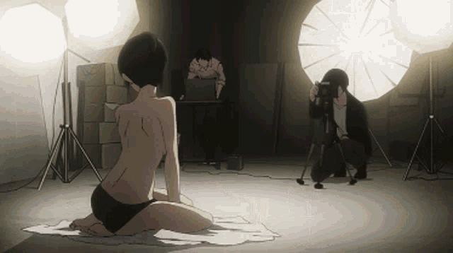 a man taking a picture of a naked woman in a dark room