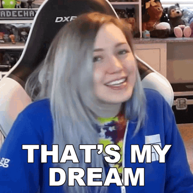 a woman sitting in a gaming chair with the words that 's my dream on her face