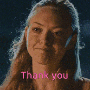 a woman with long hair says thank you in pink