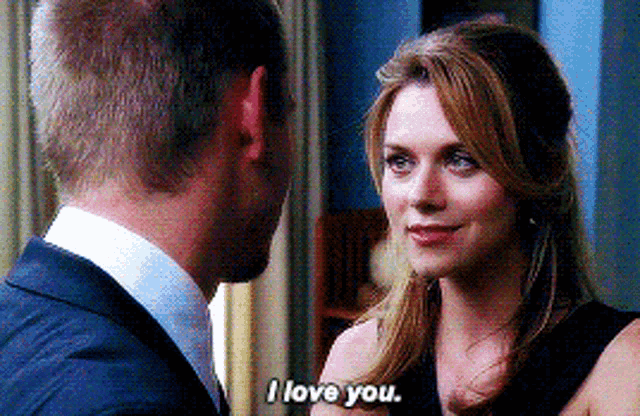 a man and woman are looking at each other and the woman is saying i love you