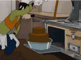 a cartoon of goofy putting a cake in an oven that says ' awful hot ' on it