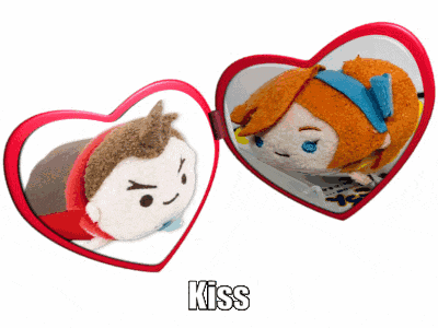 a couple of stuffed animals are in a heart shaped mirror and the word kiss is above them