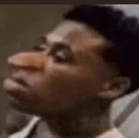 a close up of a man with a fake nose .