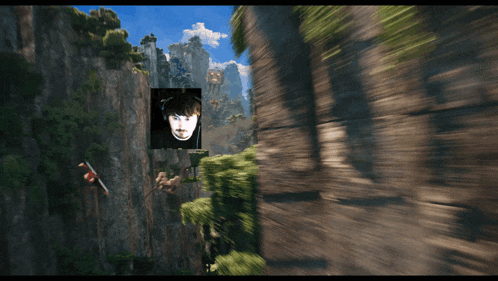 a picture of a man hanging from a cliff with a picture of him in the corner