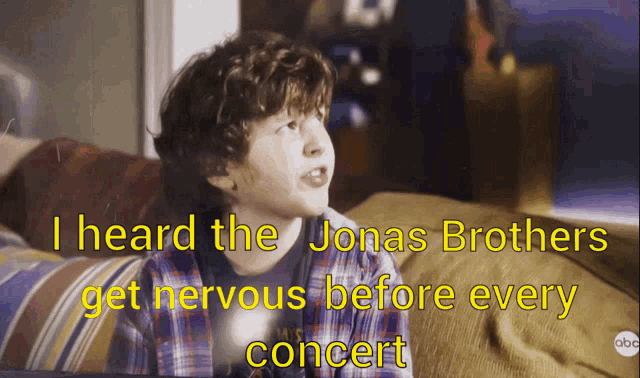 a young boy sitting on a couch with the words i heard the jonas brothers get nervous before every concert on the bottom
