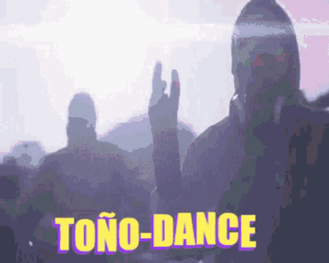 a man in a gas mask is giving a devil horns sign