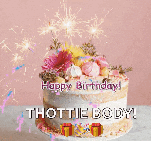 a birthday cake with flowers and sparklers and the words happy birthday thotie body