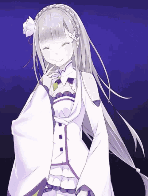 a girl with a flower in her hair is smiling with her eyes closed