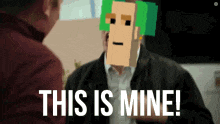 a man with a pixelated face and the words " this is mine " behind him