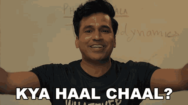 a man in front of a white board with the words kya haal chaal on it