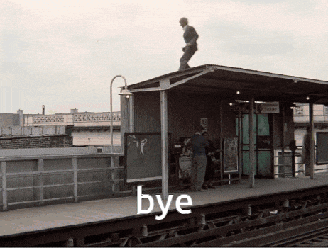 a man standing on top of a train platform with the word bye written on it