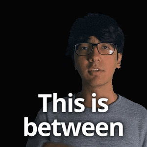a man with glasses says the both of us while holding his chest