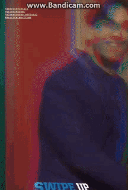 a man in a blue suit is laughing with the words swipe up written below him