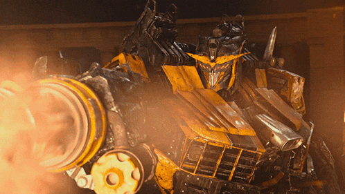 a yellow and black robot with a cannon in its hand