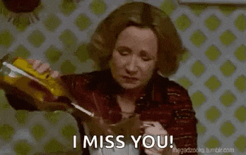 a woman is pouring a bottle of soda into a glass and saying `` i miss you '' .