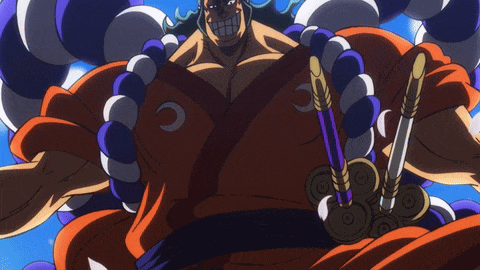 a man in a kimono is holding a sword and a purple and white beads around his neck